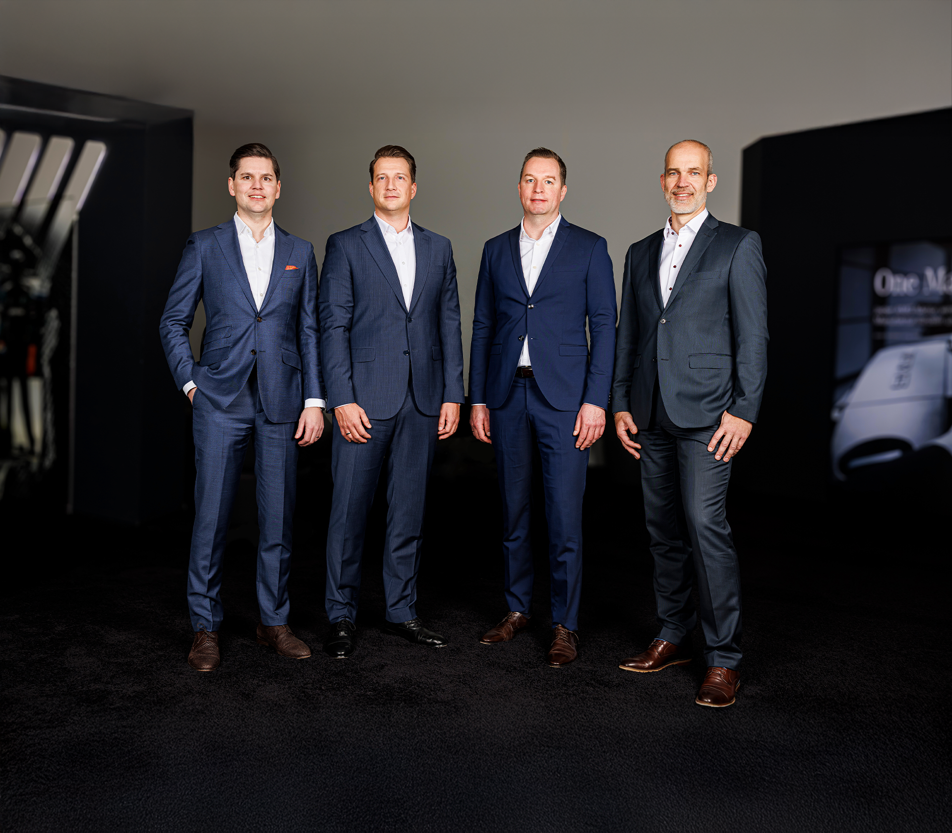 Ein aktuelles Bilder der Geschäftsführung. Herr Plischek, Herr Zierold, Herr Schlieper und Herr Knapp tragen einen Anzug